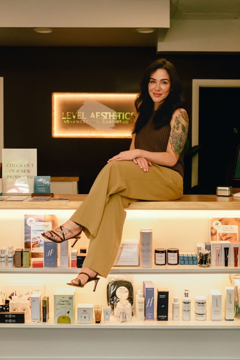 Kristen Kane at the Level Aesthetics retail counter