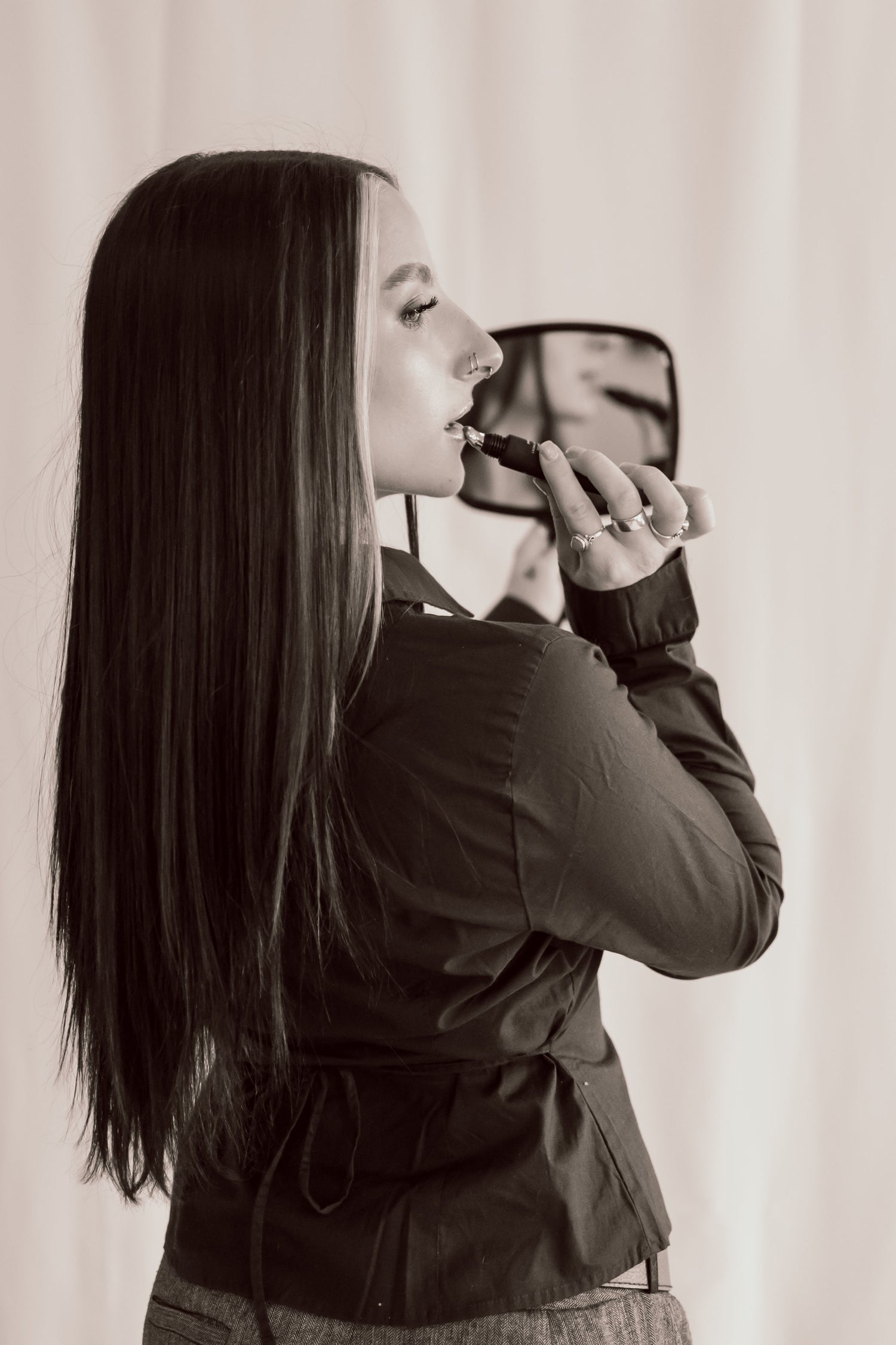 Professional spray tanning application at Level Aesthetics -- streak-free bronze finish