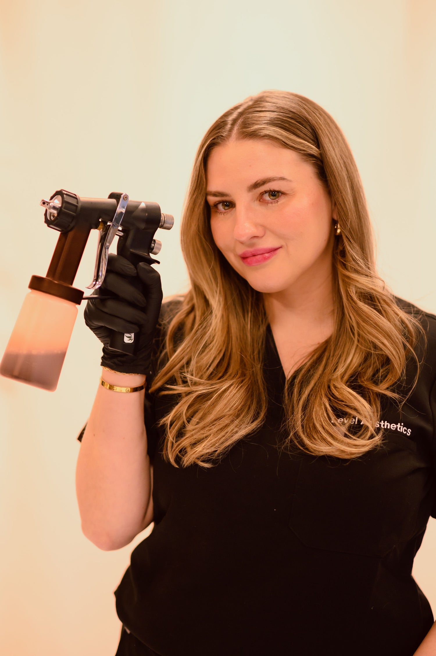 Spray tan results at Level Aesthetics -- even, natural-looking bronze glow