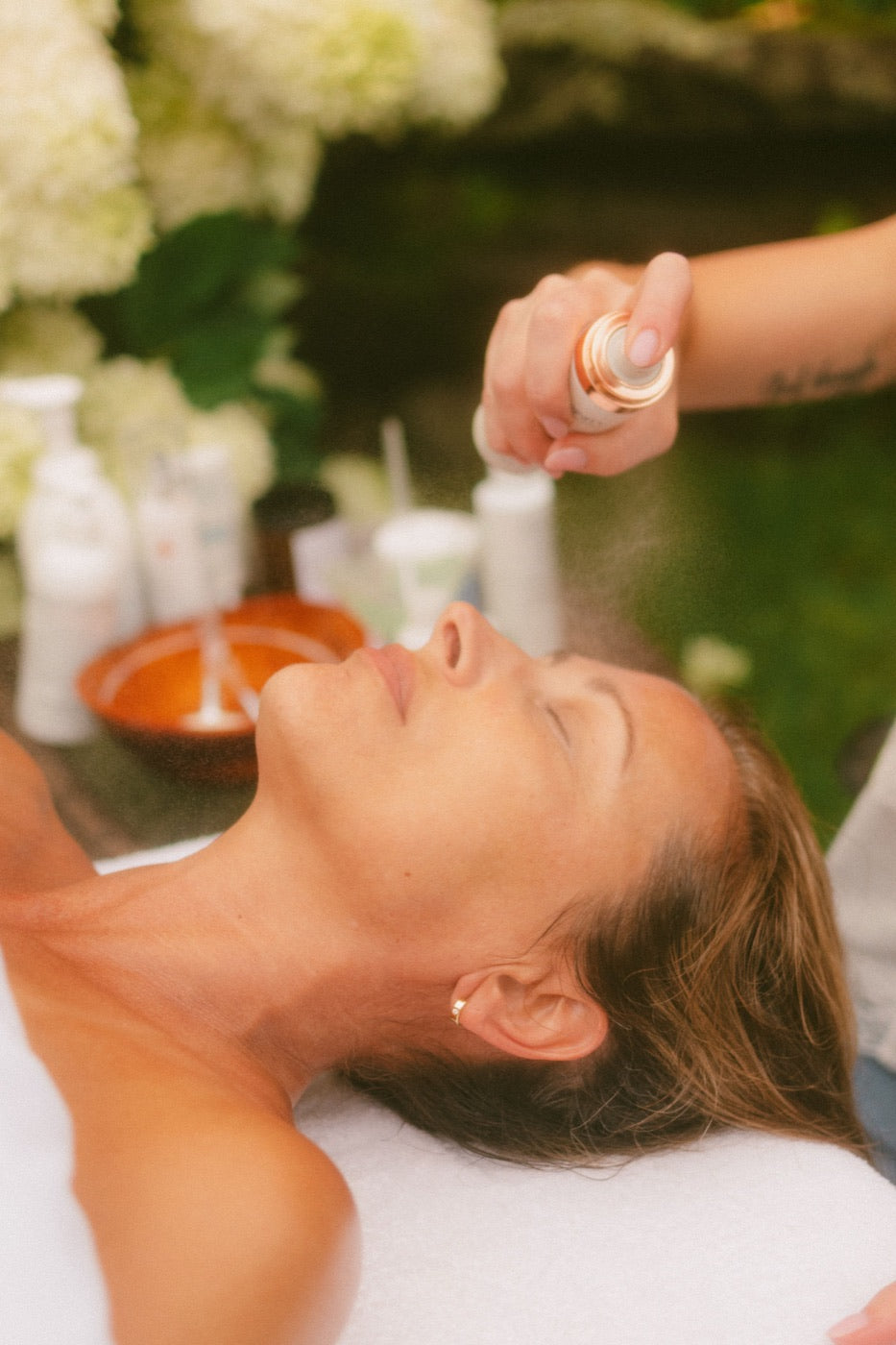 Facial mist during a treatment by Level Aesthetics