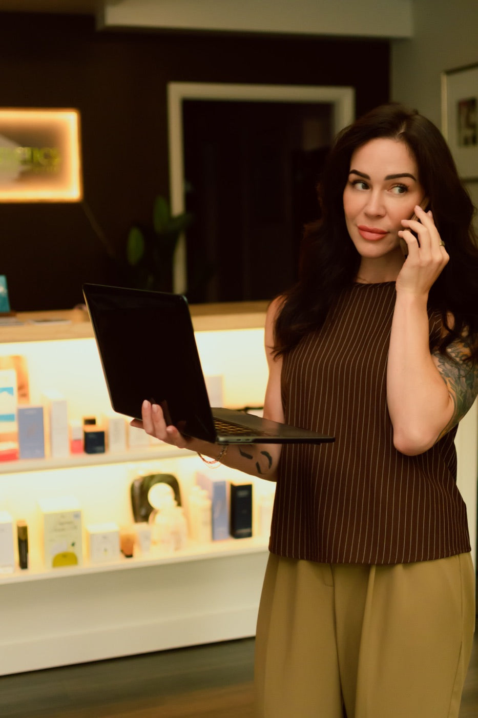 Kristen Kane on a call at the Level Aesthetics studio